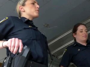 Busty officers in the office are looking for a criminal that's a big